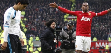 Patrice Evra celebrates the win against Liverpool